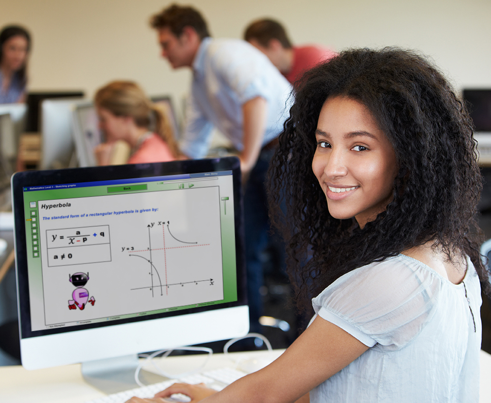 Female College Student Using Computer In Classroom